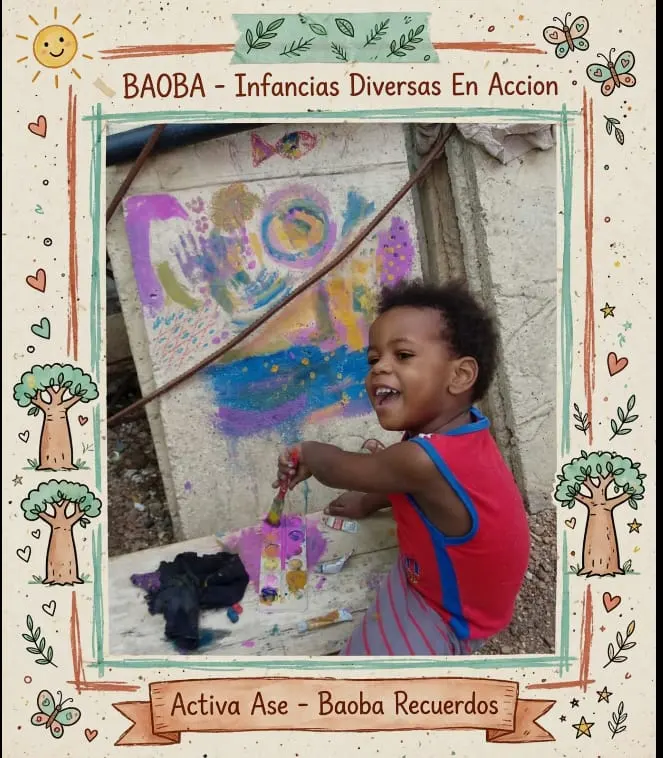 Un niño pequeño sonríe mientras pinta con un pincel sobre un muro cubierto de manchas de colores.